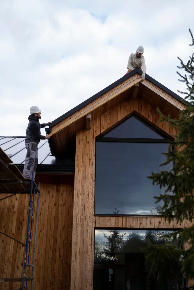 Tekton Exteriors roofers working on a residential roof
